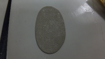 Roll the clay once to add texture