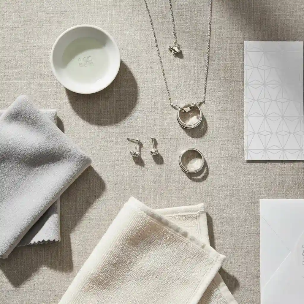 Does sterling silver tarnish in water care guidance image showing silver jewelry maintenance tools and premium aftercare setup